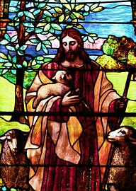 Stained glass depiction of Jesus as the good shepherd