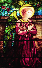 Stained glass angel in red robe by Tiffany Studios